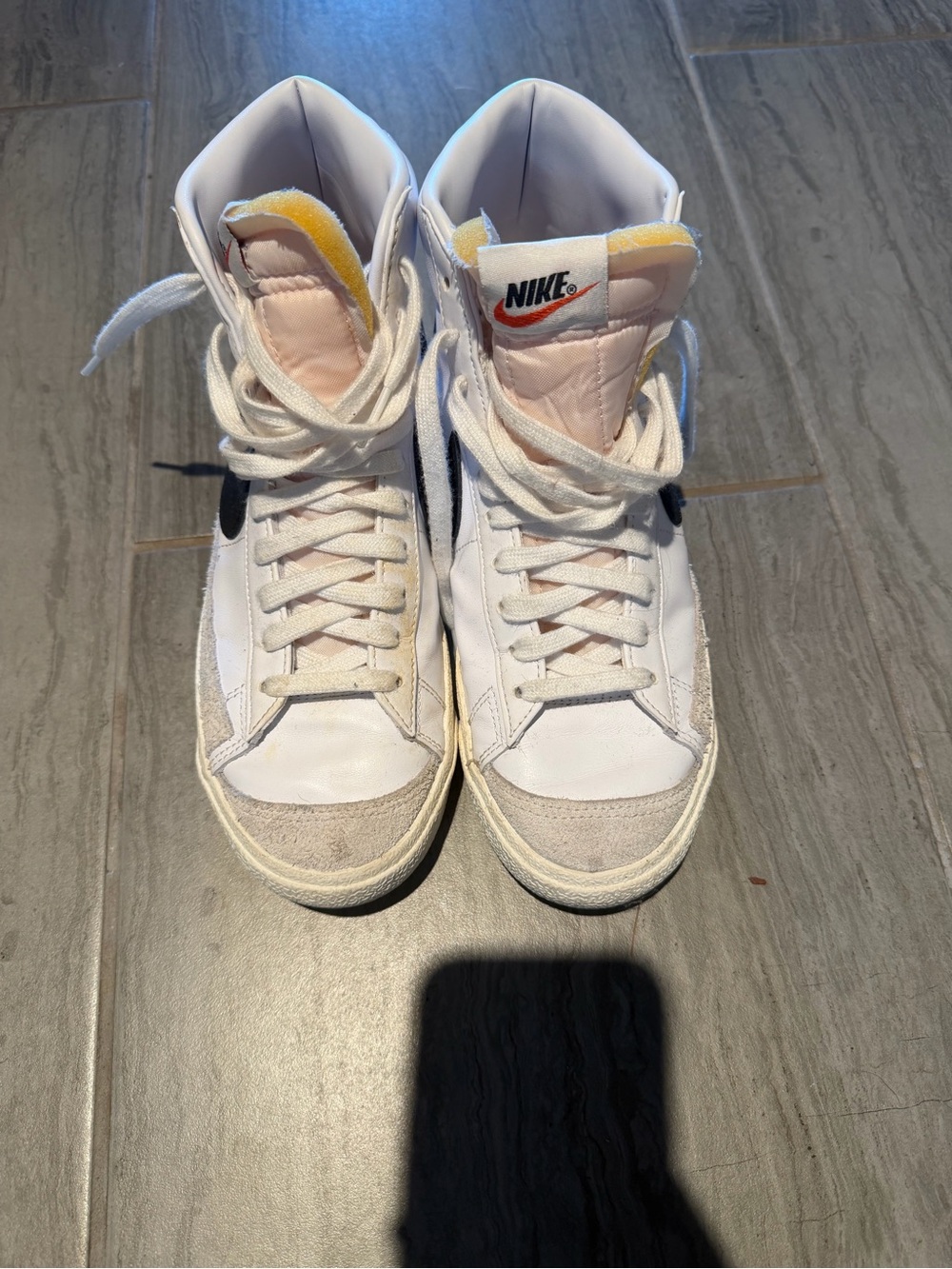 Nike Women's White High-Top Sneakers with Black Swoosh and Pink Tongue